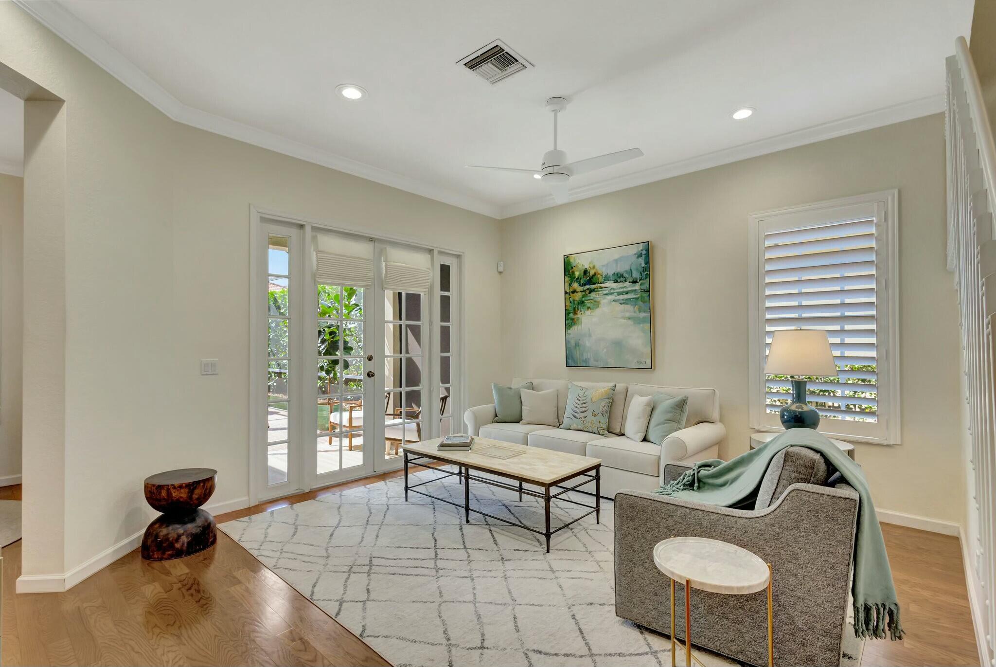 106 Via Santa Cruz Jupiter, FL 33458 - Photo 19 of 71 a living room with furniture and a potted plant