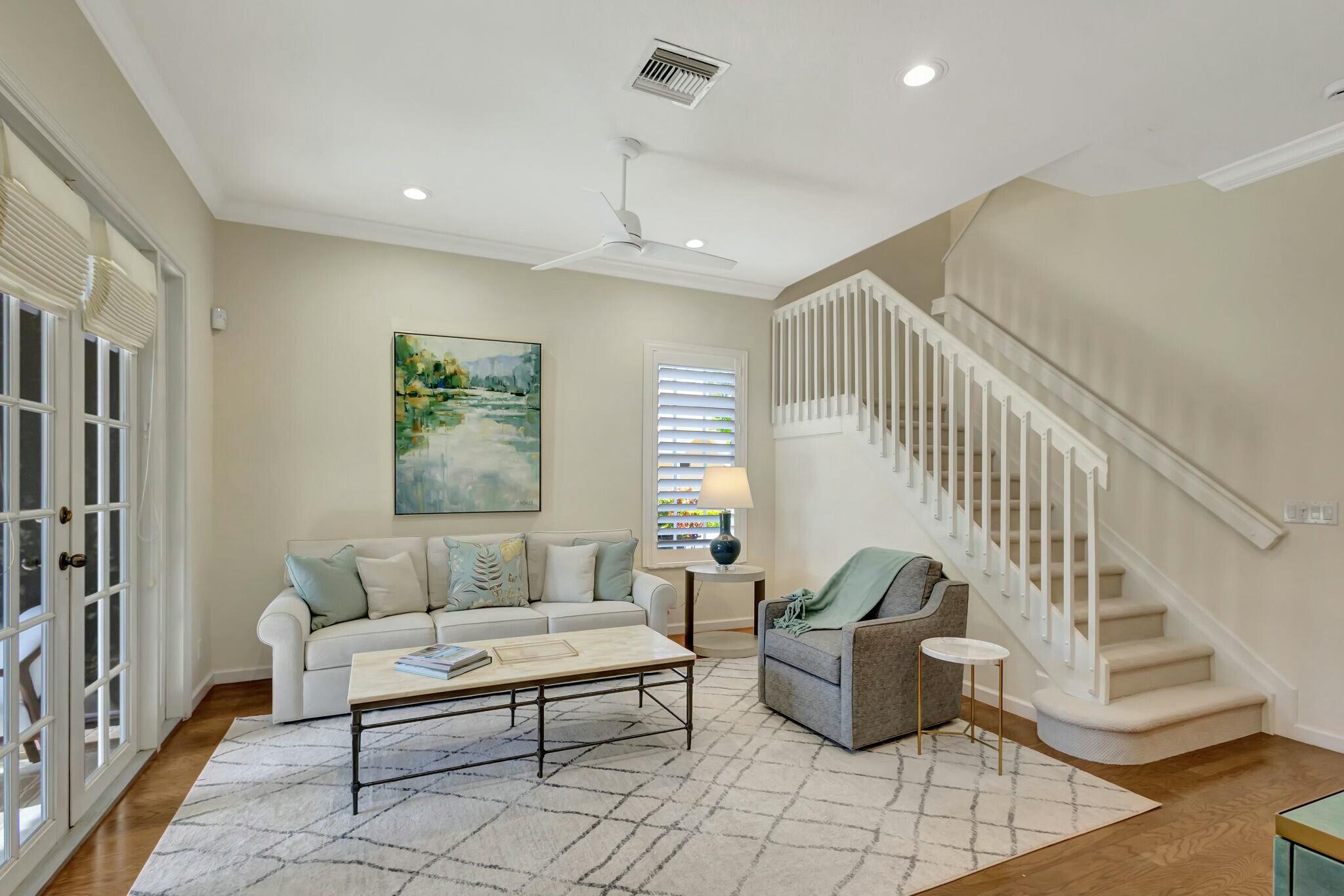 106 Via Santa Cruz Jupiter, FL 33458 - Photo 23 of 71 a living room with furniture and a stairs