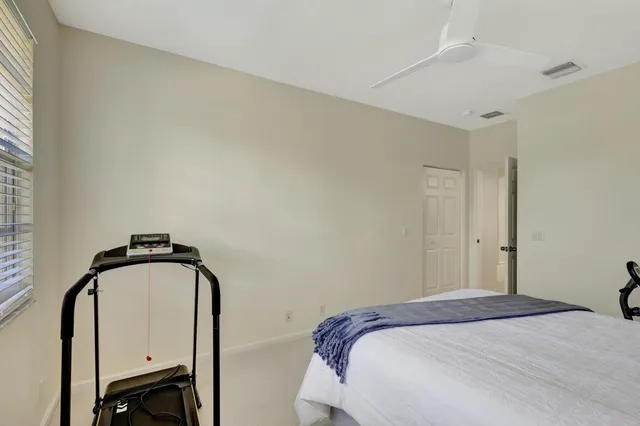 a bathroom with a large tub sink vanity granite and a shower