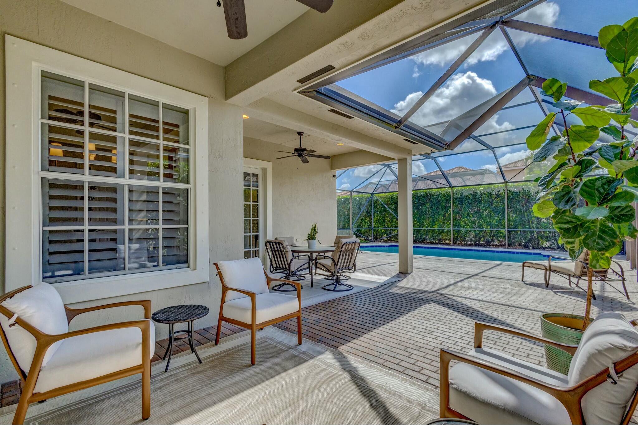 106 Via Santa Cruz Jupiter, FL 33458 - Photo 48 of 71 a building outdoor space with patio furniture