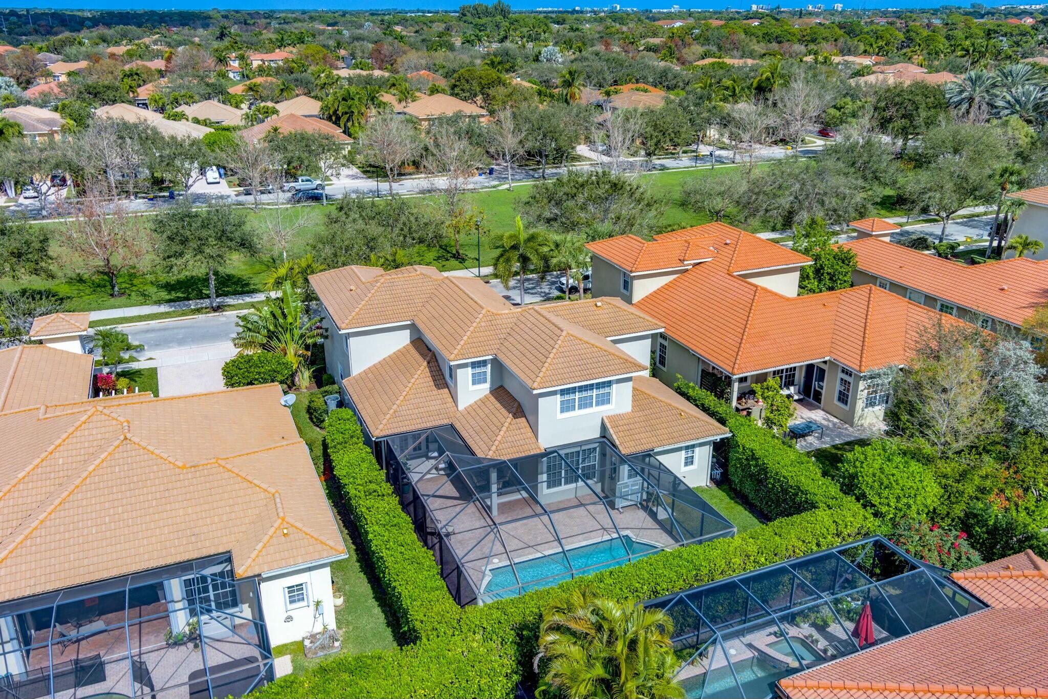 106 Via Santa Cruz Jupiter, FL 33458 - Photo 63 of 71 an aerial view of a house with garden space and street view