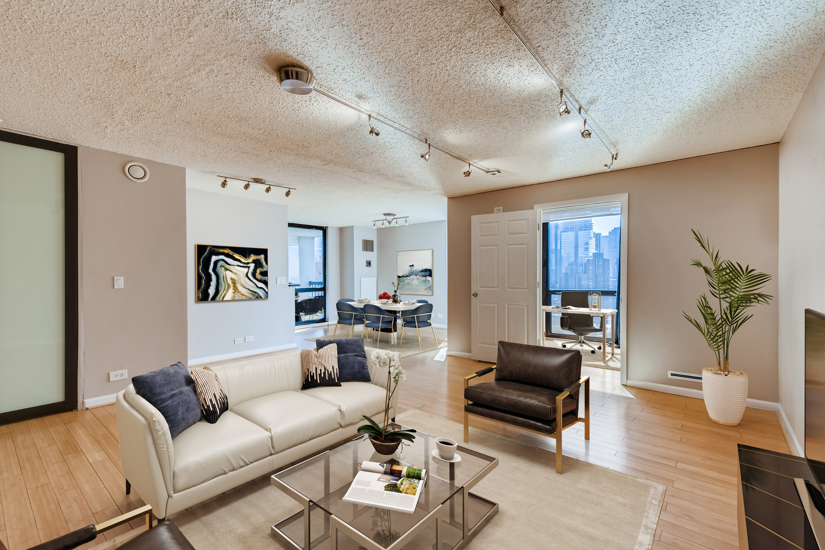 1122 North Clark Street, Unit 2208 Chicago, IL 60610 - Photo 2 of 11 a living room with furniture and wooden floor