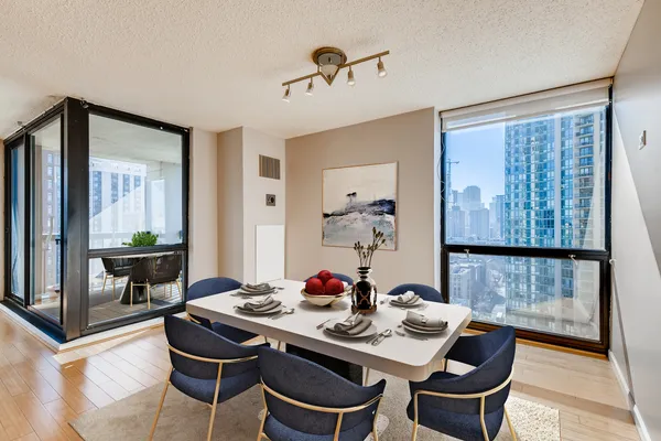 a view of a dining room with furniture and window