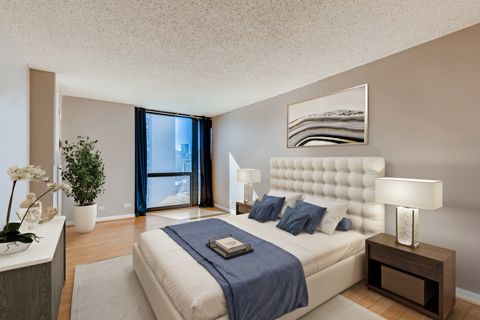 1122 North Clark Street, Unit 2208 Chicago, IL 60610 - Photo 7 of 11 a bedroom with a bed and a potted plant