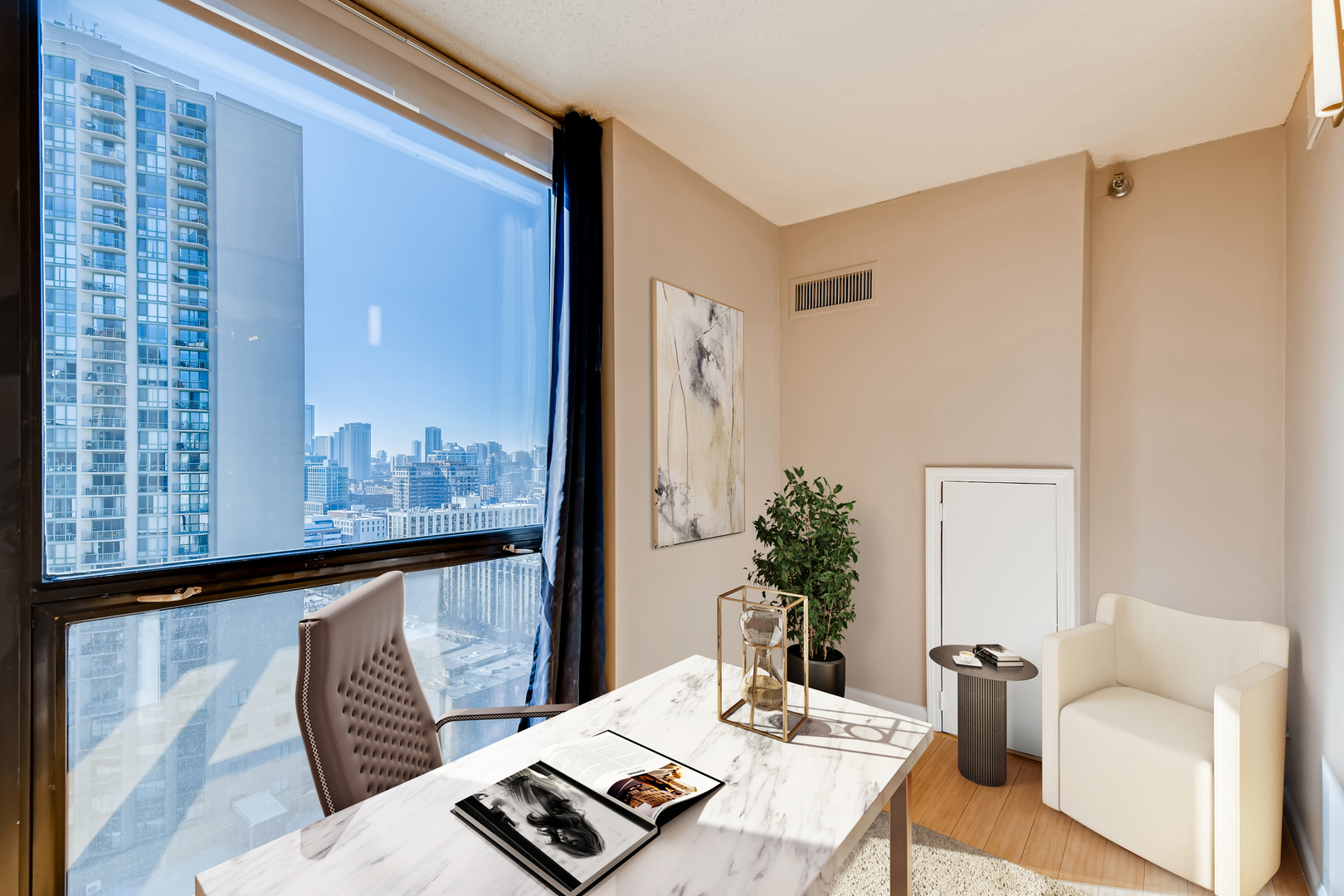 1122 North Clark Street, Unit 2208 Chicago, IL 60610 - Photo 8 of 11 a living room with furniture and wooden floor