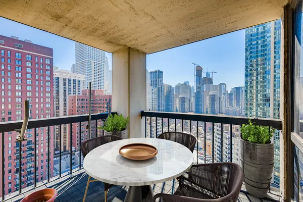 a view of a balcony with chairs