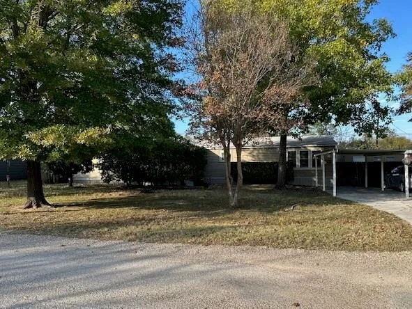 a view of a yard in front of a house