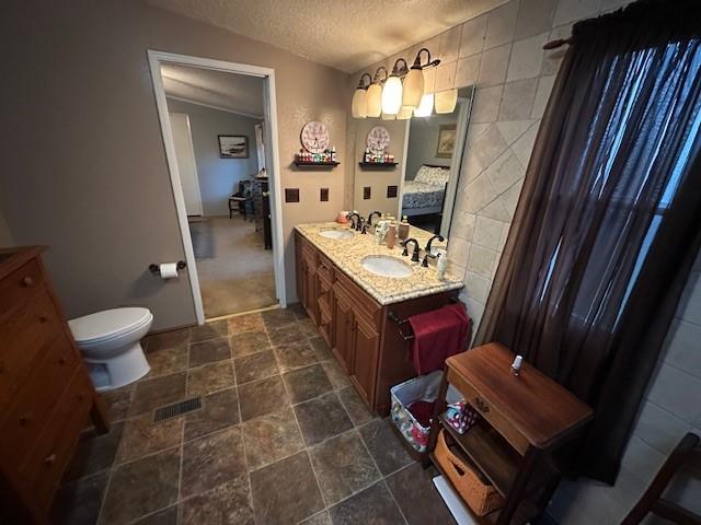 2100 Dove Loop Road, Unit 30 Grapevine, TX 76051 - Photo 11 of 29 a bathroom with a sink mirror vanity and toilet