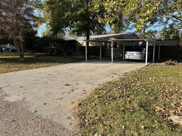 2100 Dove Loop Road, Unit 30 Grapevine, TX 76051 - Photo 28 of 29 a front view of a house with a garden