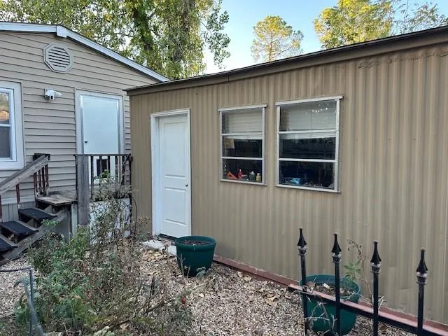 a backyard of a house with seating space
