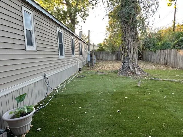 a view of a backyard with sitting area