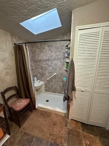 a bathroom with a sink mirror vanity and toilet
