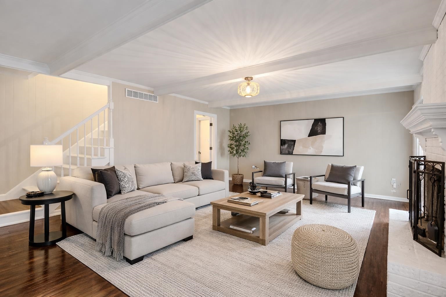 1658 Miller Farms Road Germantown, TN 38138 - Photo 13 of 39 Living area with wood finished floors, beam ceiling, and a fireplace with raised hearth