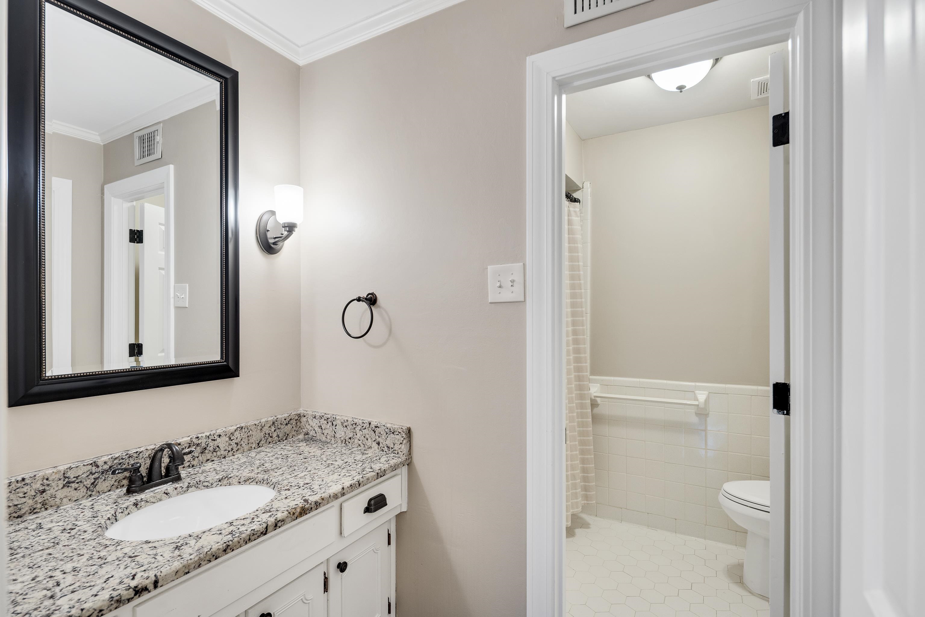 1658 Miller Farms Road Germantown, TN 38138 - Photo 22 of 39 Bathroom featuring curtained shower, vanity, crown molding, and tile walls