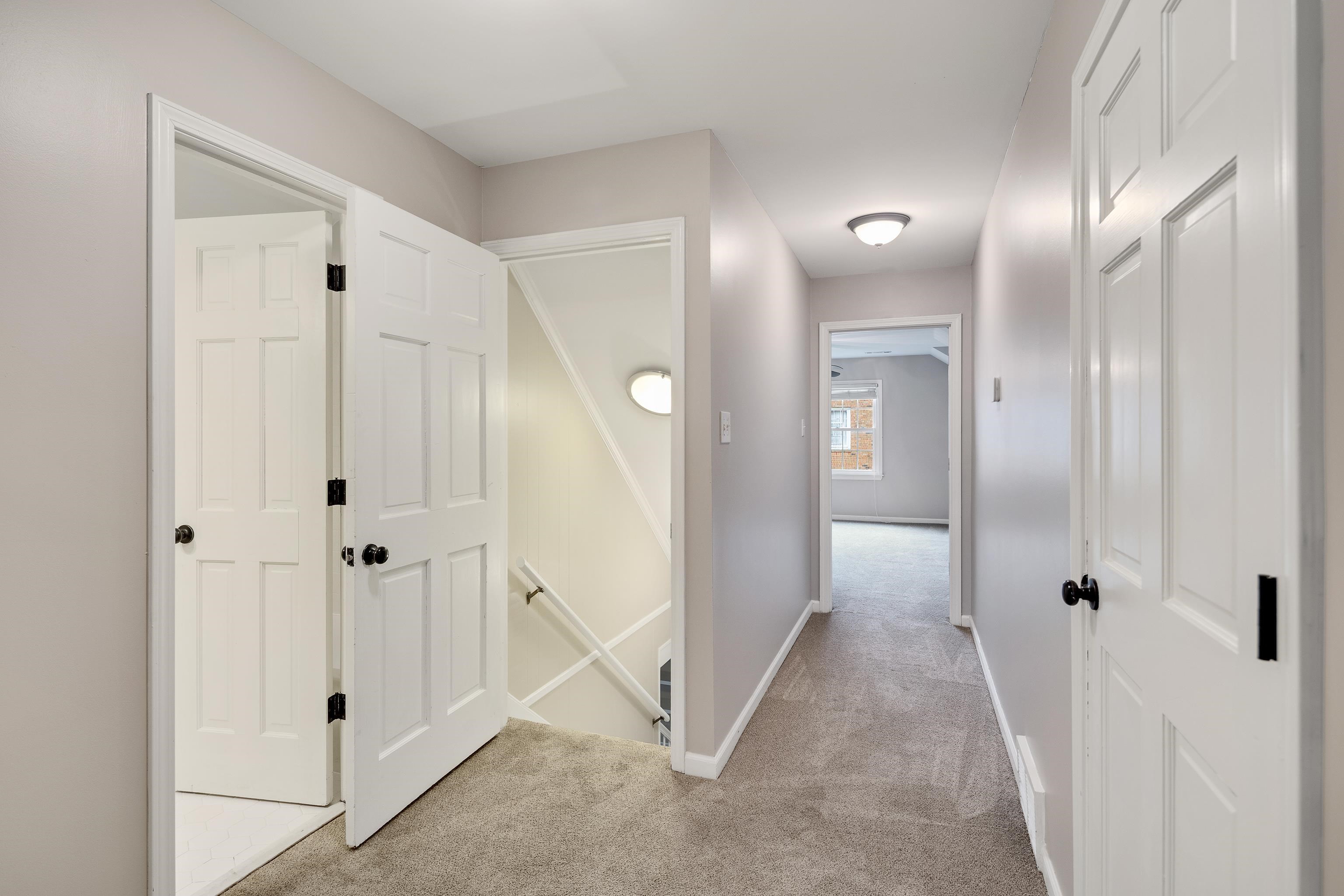 1658 Miller Farms Road Germantown, TN 38138 - Photo 27 of 39 Hall with light colored carpet and an upstairs landing