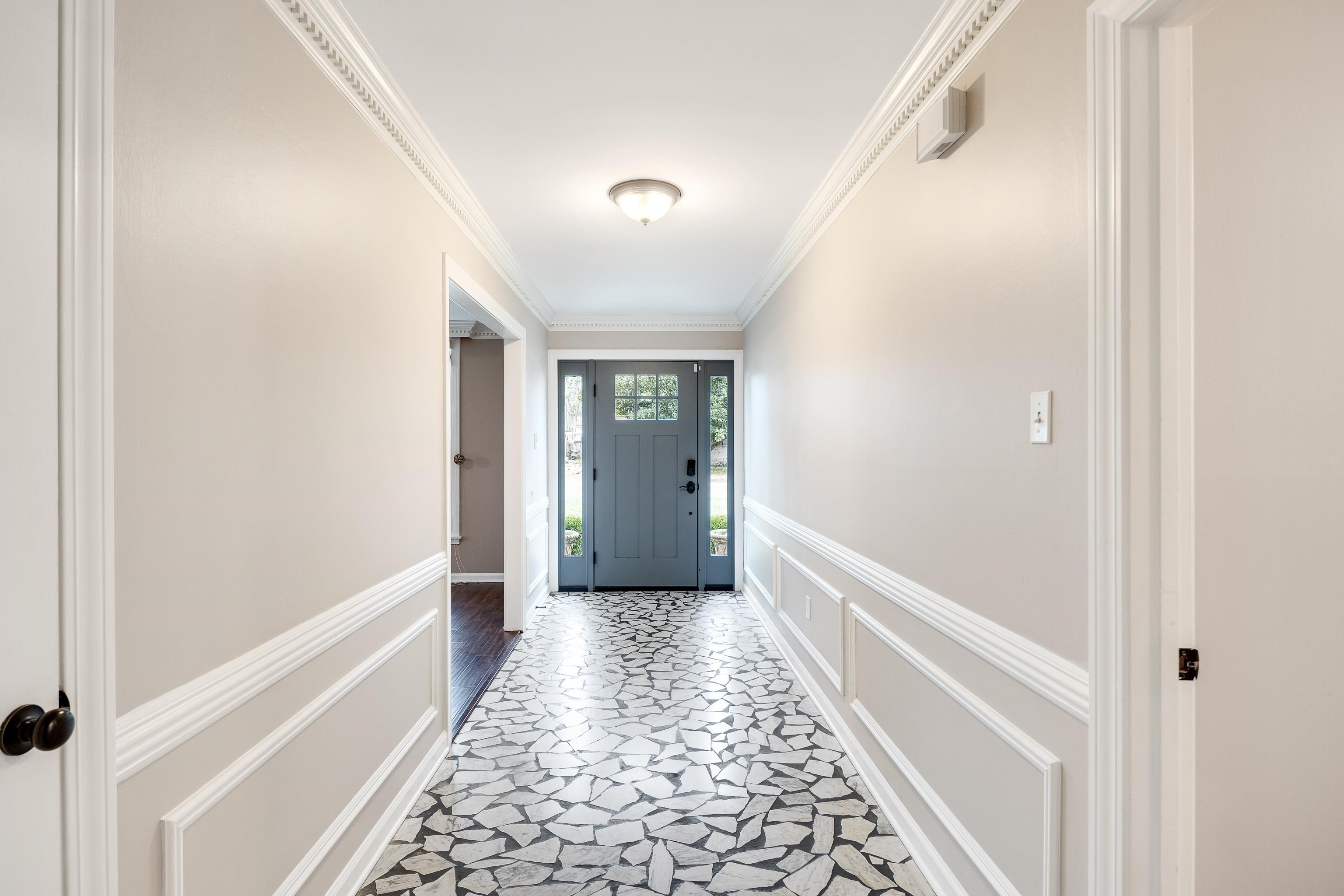1658 Miller Farms Road Germantown, TN 38138 - Photo 3 of 39 Doorway featuring a decorative wall, ornamental molding, and wainscoting