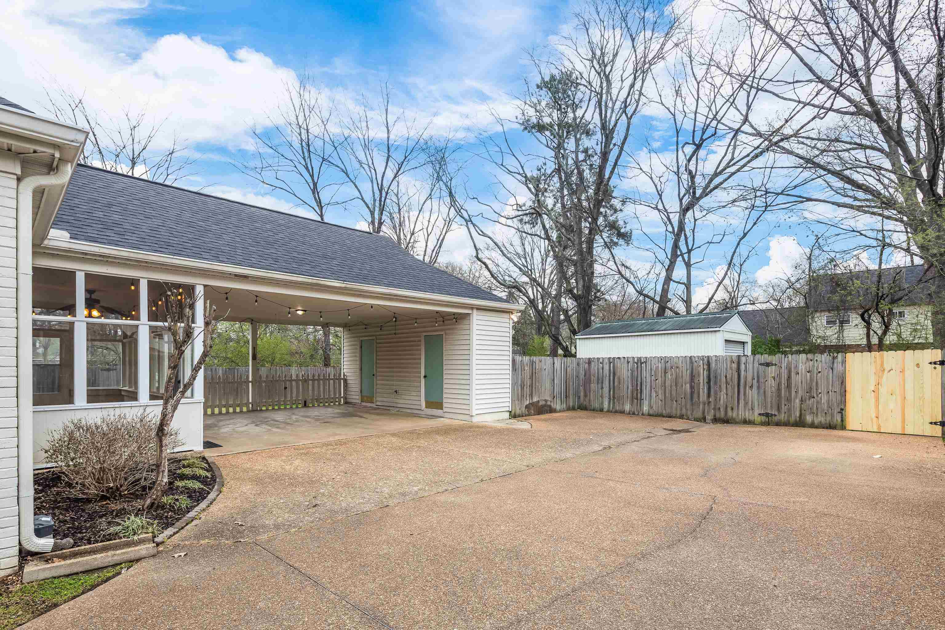 1658 Miller Farms Road Germantown, TN 38138 - Photo 33 of 39 View of parking with driveway and a carport
