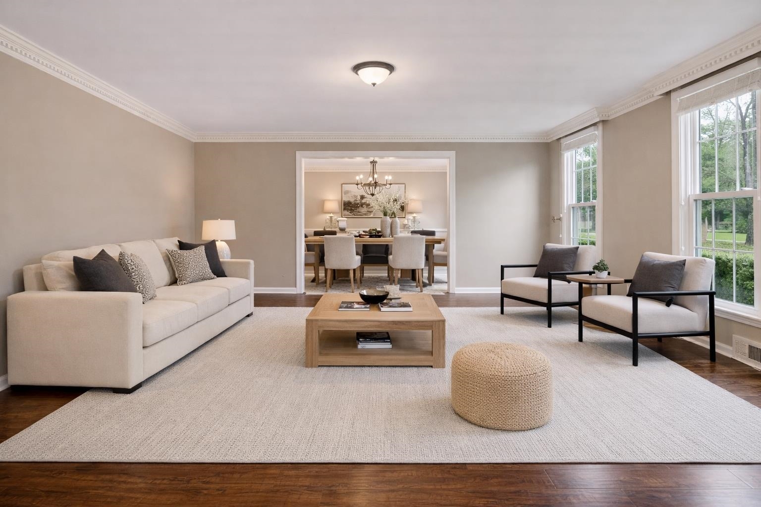 1658 Miller Farms Road Germantown, TN 38138 - Photo 4 of 39 Living area with wood finished floors, a chandelier, and crown molding