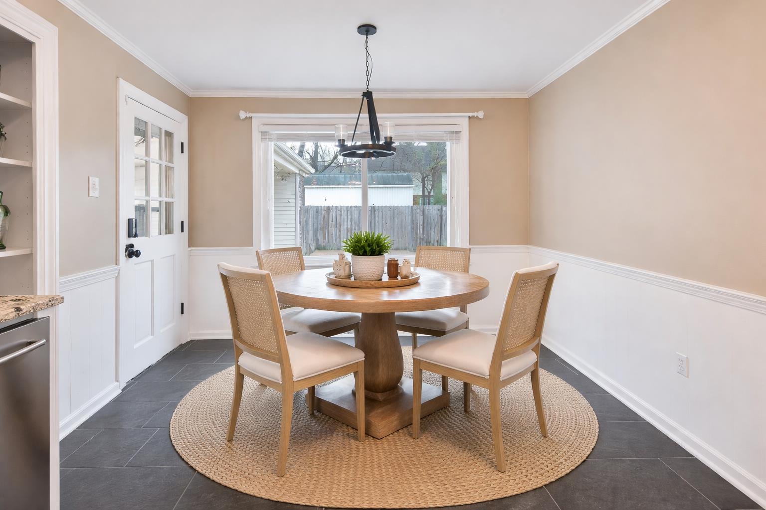 1658 Miller Farms Road Germantown, TN 38138 - Photo 10 of 39 Dining area with ornamental molding, wainscoting, built in shelves, and hanging lights