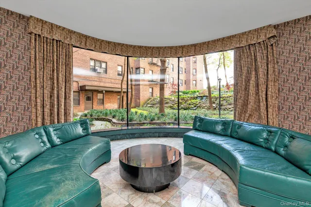 a living room with a couch and a large window