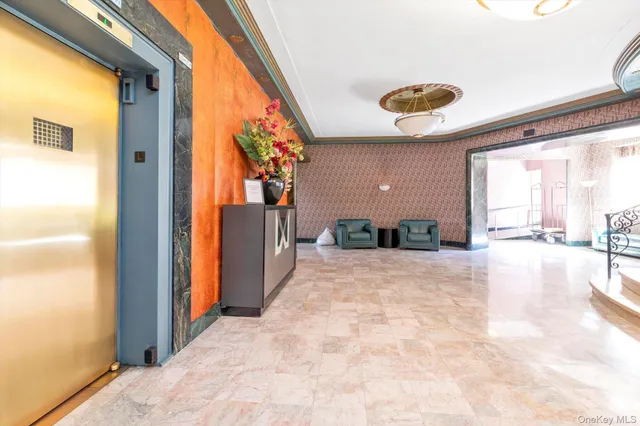 a view of a porch with a table and chairs