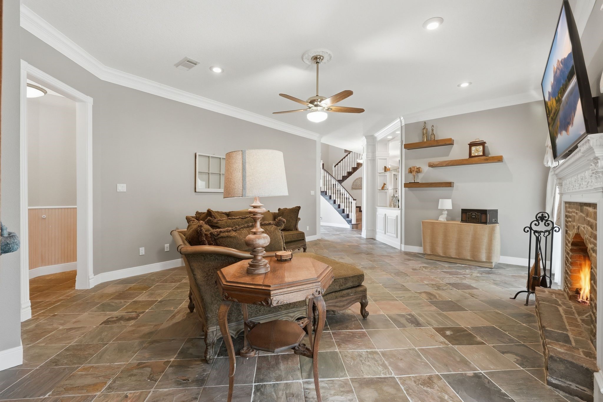 25014 Northampton Terrace Drive Spring, TX 77389 - Photo 17 of 41 Another view of the family room and it's stunning slate flooring & crown moulding