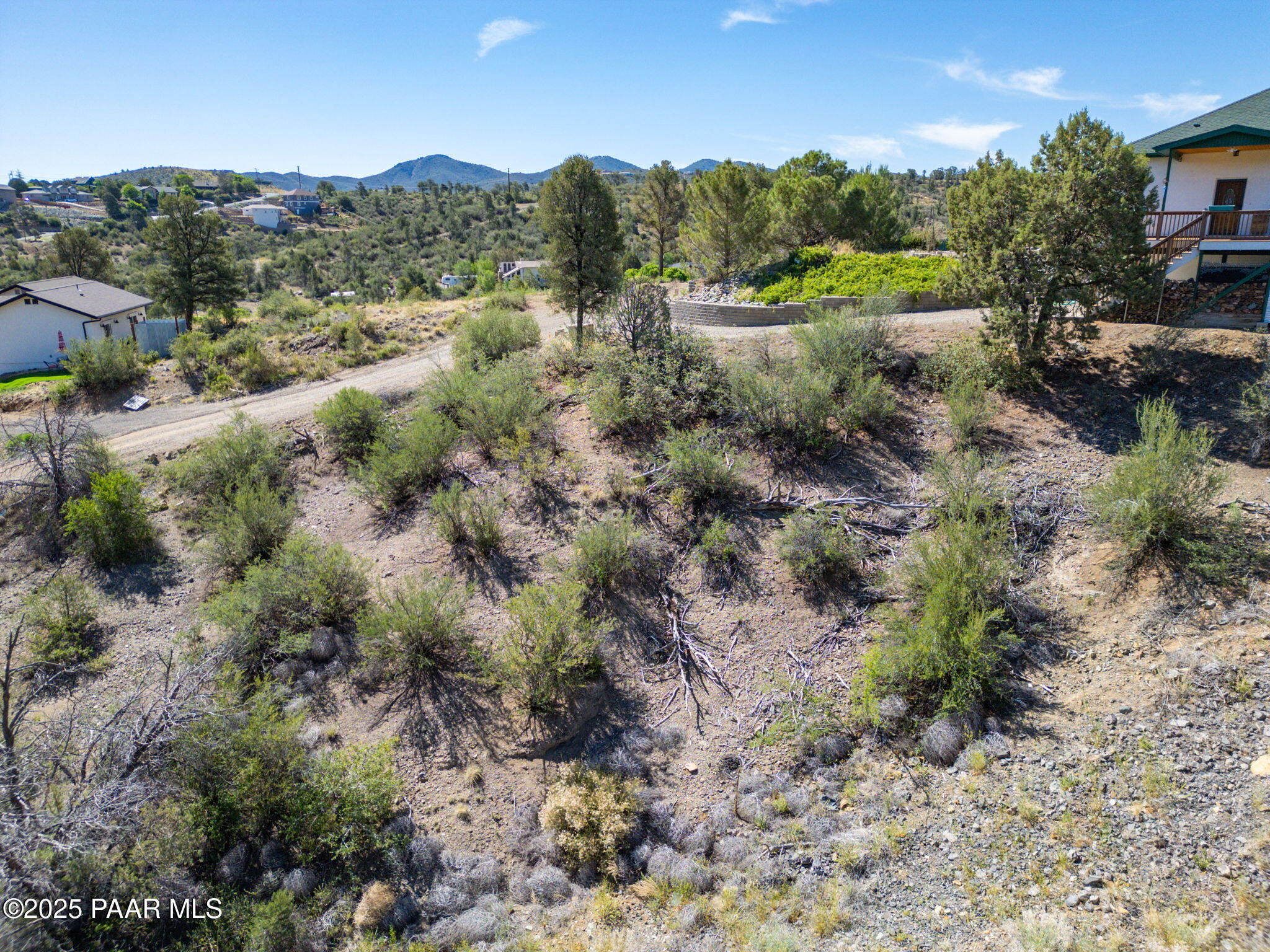 1128 Rhinestone Drive Prescott, AZ 86301 - Photo 2 of 11 a view of a forest with trees and houses