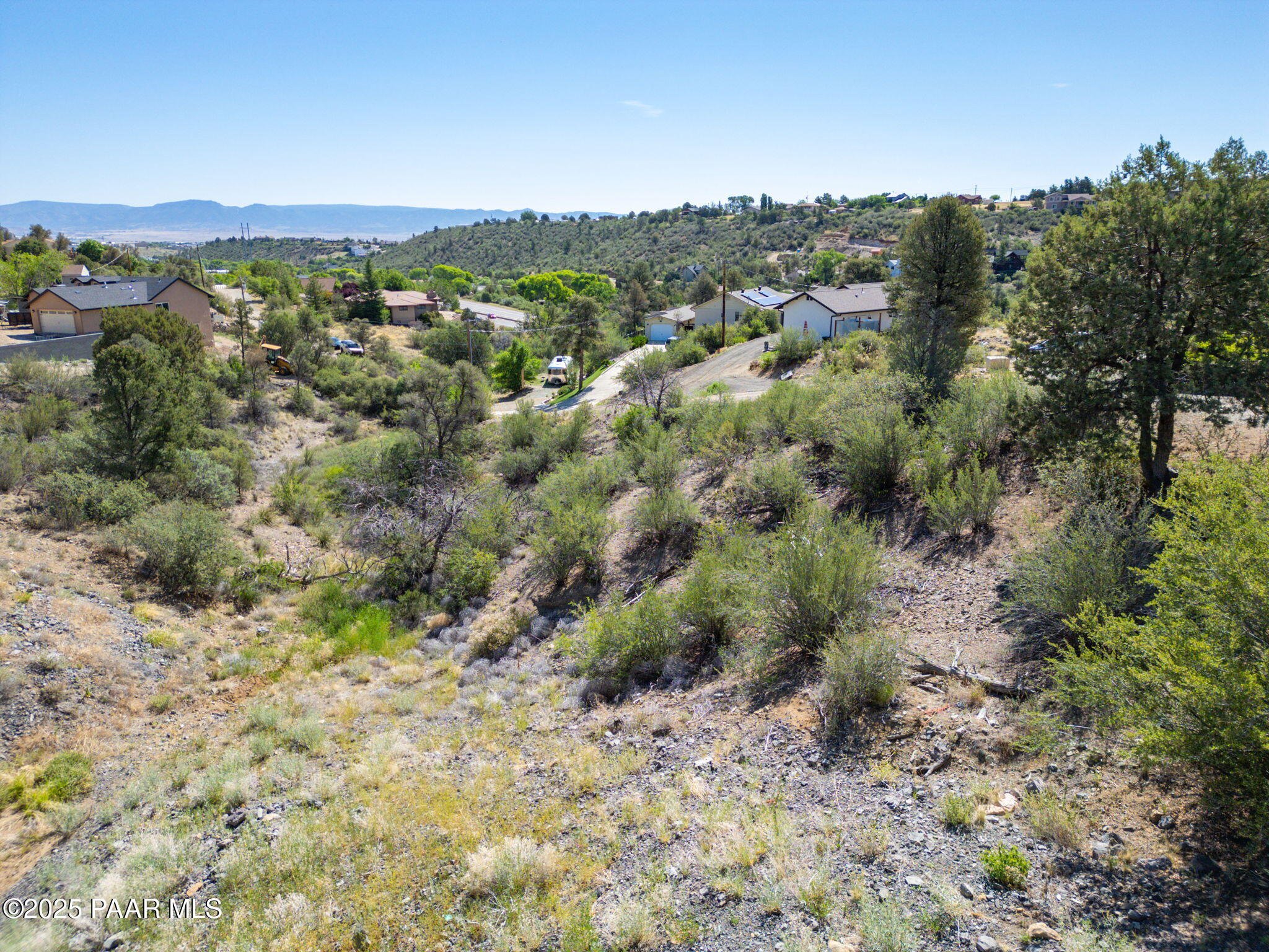 1128 Rhinestone Drive Prescott, AZ 86301 - Photo 5 of 11 a view of a forest with a street