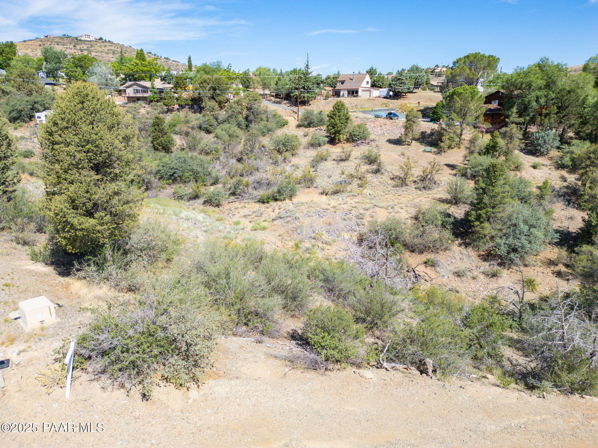 1128 Rhinestone Drive Prescott, AZ 86301 - Photo 8 of 11 a view of a forest with a street