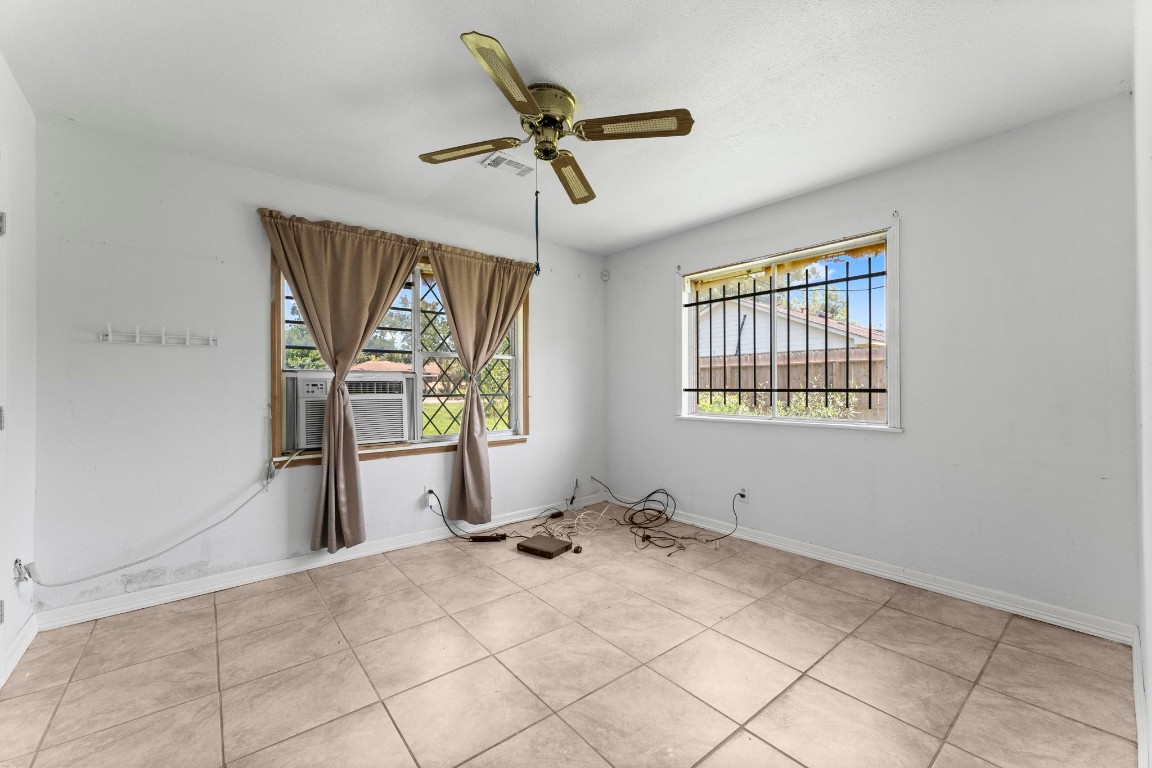 814 Isetta Lane Houston, TX 77060 - Photo 21 of 30 a view of a livingroom with wooden floor and a ceiling fan