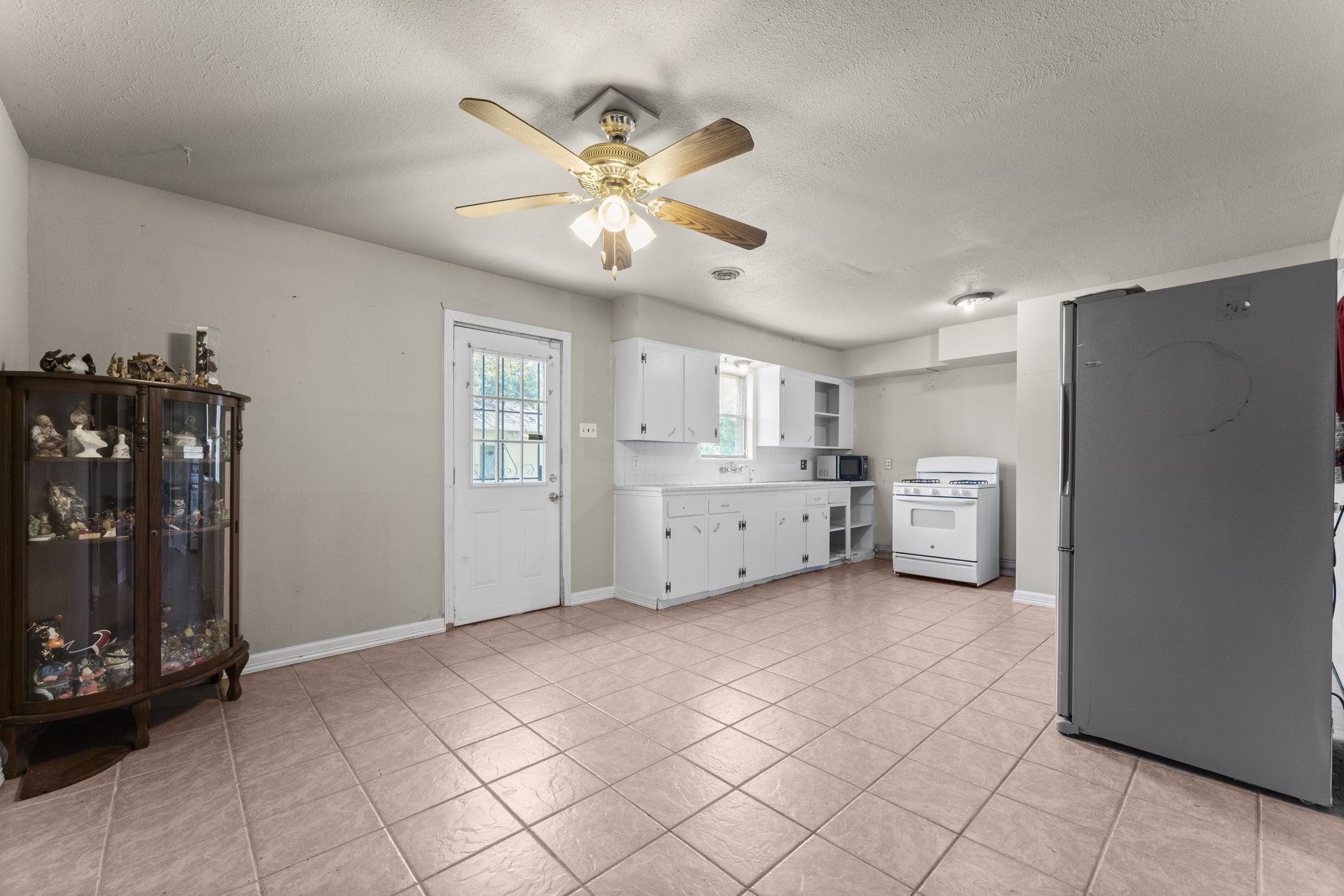 814 Isetta Lane Houston, TX 77060 - Photo 5 of 30 a view of a kitchen with a sink and cabinet with wooden floor