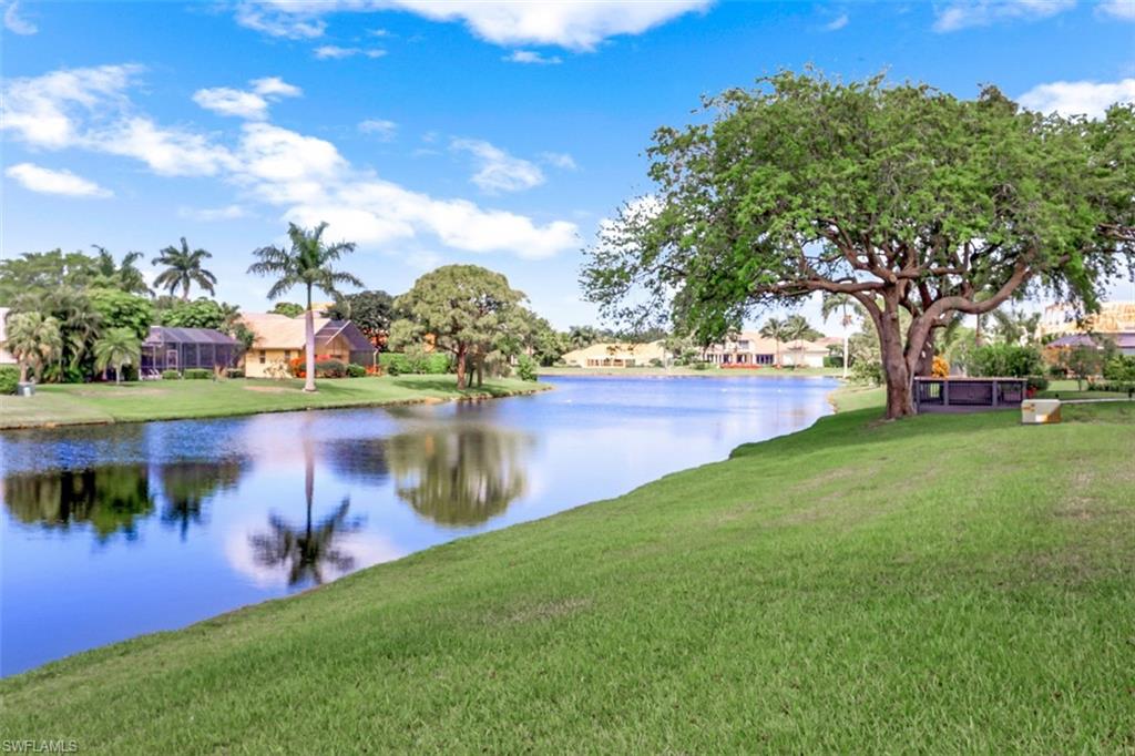 619 Neapolitan Way Naples, FL 34103 - Photo 2 of 32 a view of a lake with houses