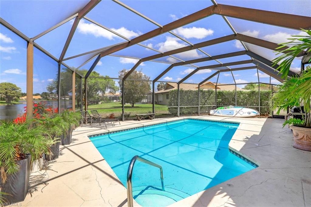 619 Neapolitan Way Naples, FL 34103 - Photo 25 of 32 a view of yard with patio