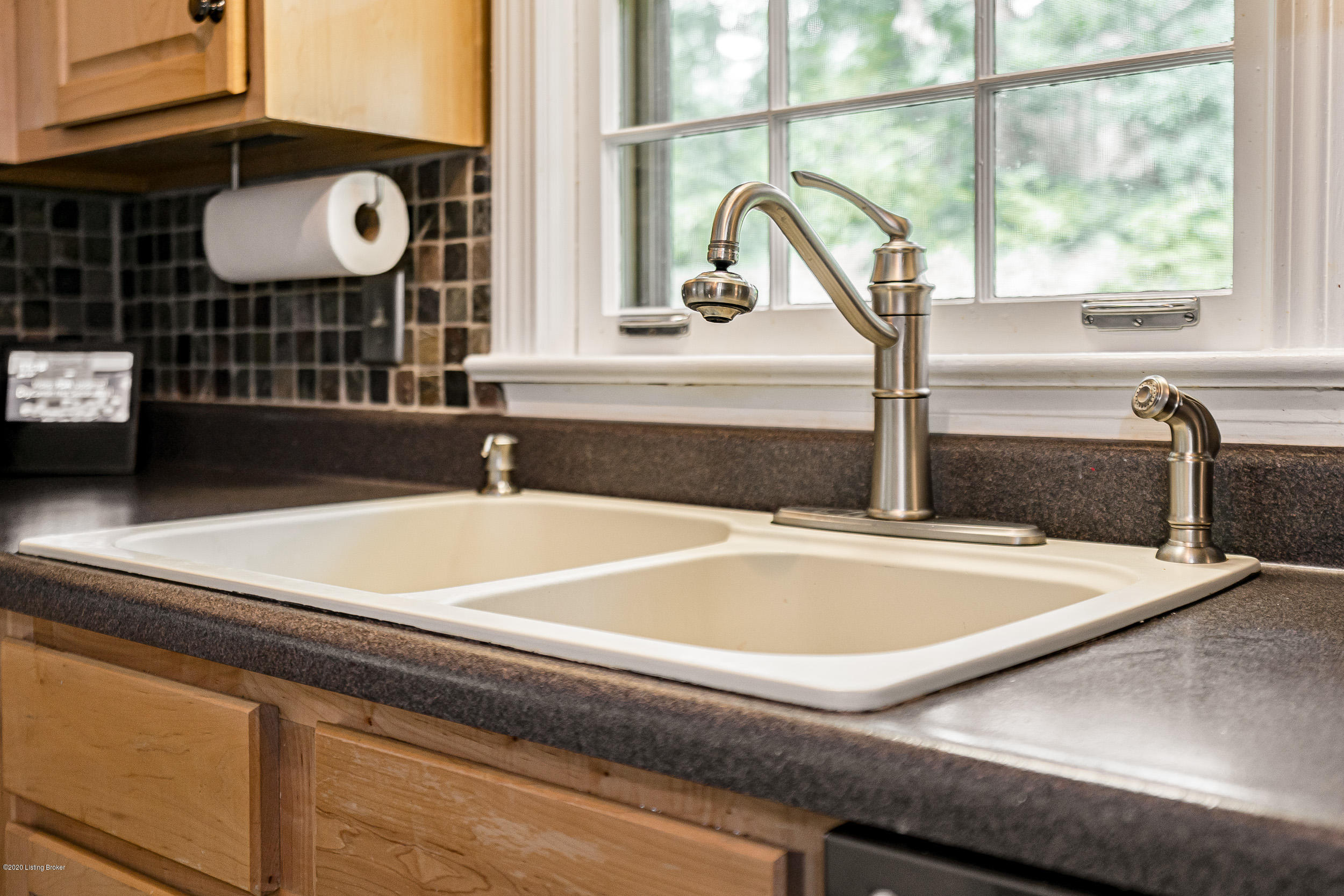 5408 Winding Road Louisville, KY 40214 - Photo 16 of 54 Large Sink under a window that looks out to the back.