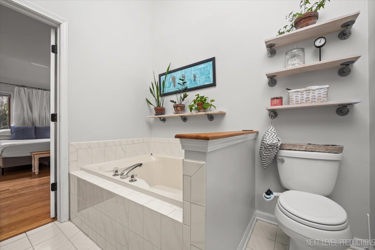 92 Red Fox Run Montgomery, IL 60538 - Photo 19 of 25 a white toilet sitting next to a bathroom sink