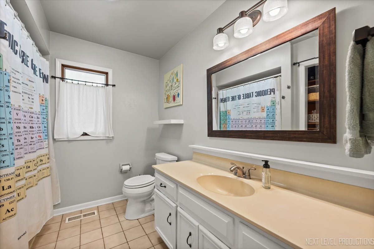 92 Red Fox Run Montgomery, IL 60538 - Photo 23 of 25 a bathroom with a granite countertop sink mirror vanity and toilet