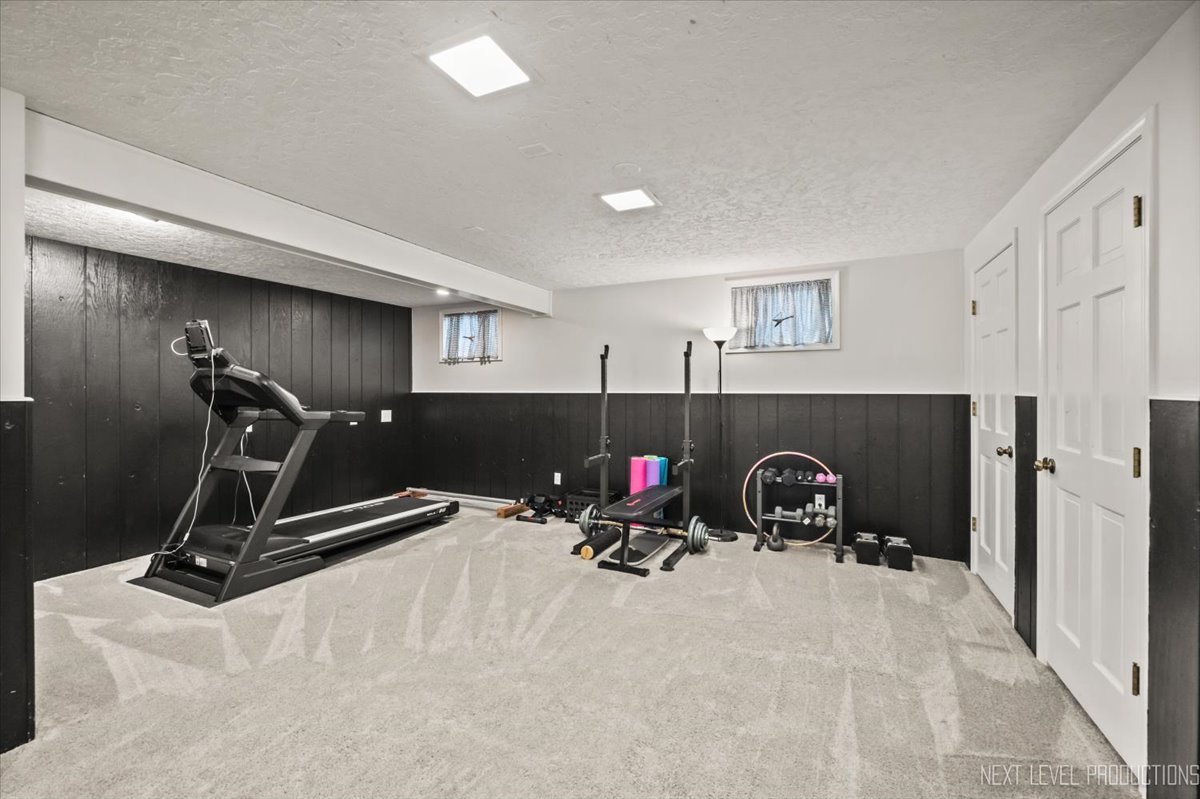 92 Red Fox Run Montgomery, IL 60538 - Photo 25 of 25 a view of a room with gym equipment