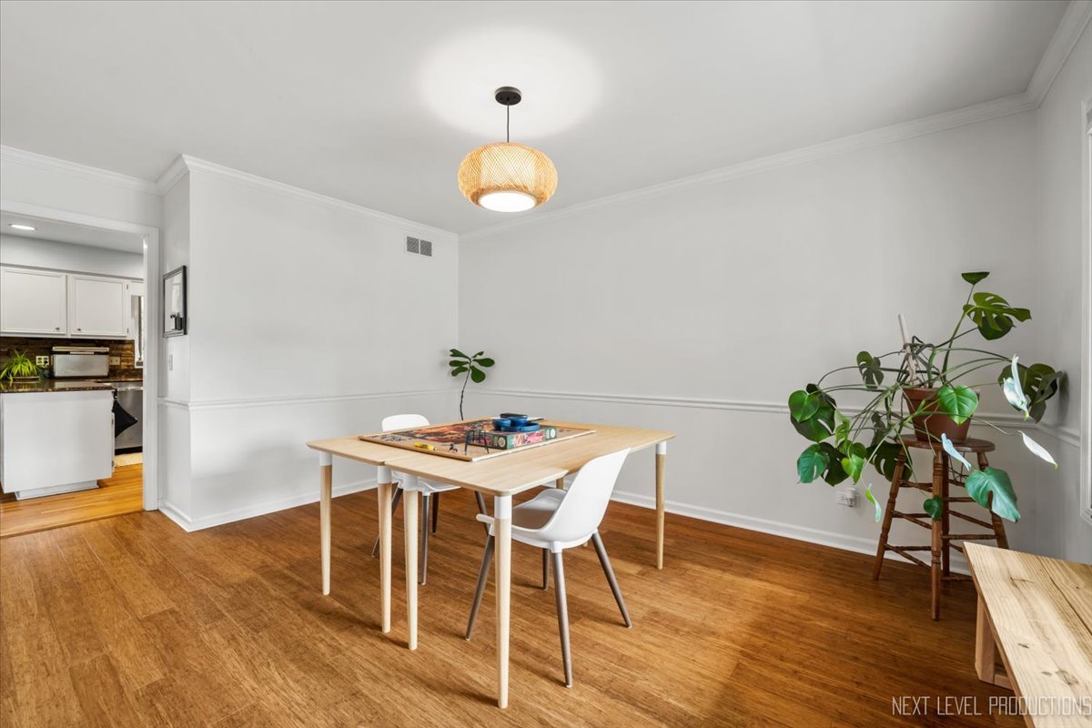 92 Red Fox Run Montgomery, IL 60538 - Photo 9 of 25 a view of a dining room with furniture and wooden floor