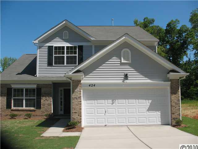 424 Rook Road Charlotte, NC 28216 - Photo 1 of 6 a front view of a house with a yard