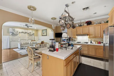a kitchen that has a lot of cabinets in it