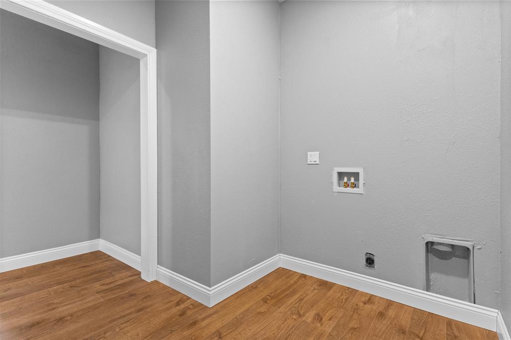 7074 Northeast County Road Rice, TX 75155 - Photo 14 of 22 a view of room with wooden floor