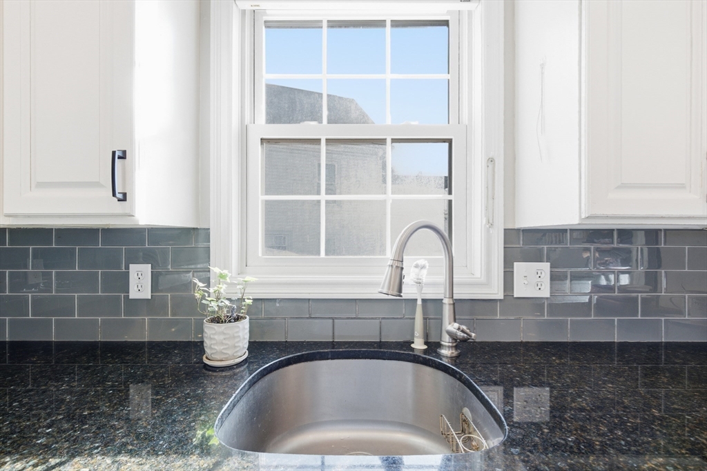 27 Emerson Street, Unit 27 Stoneham, MA 02180 - Photo 11 of 29 a kitchen with a sink and a window