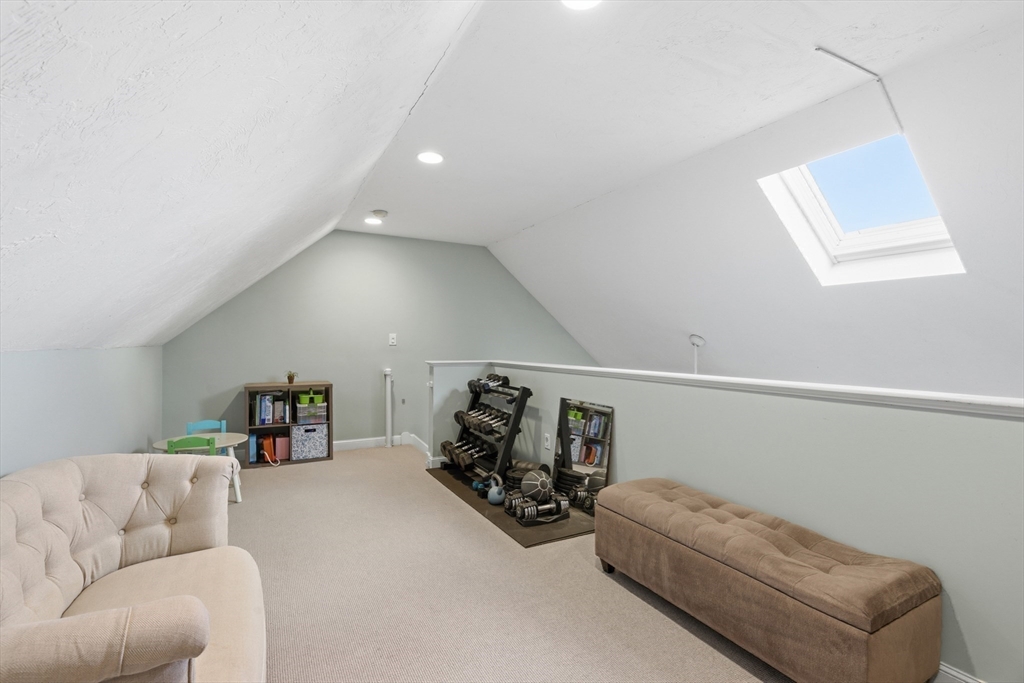 27 Emerson Street, Unit 27 Stoneham, MA 02180 - Photo 19 of 29 a living room with furniture