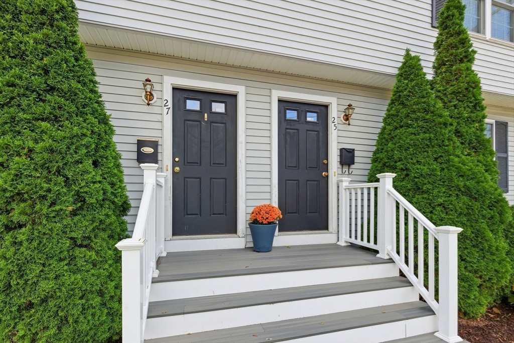 27 Emerson Street, Unit 27 Stoneham, MA 02180 - Photo 29 of 29 a front view of a house with fountain