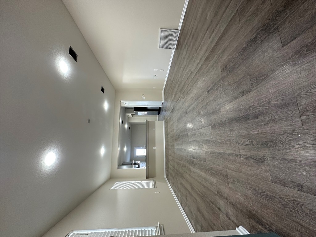 3416 Autumn Bay Drive Austin, TX 78744 - Photo 1 of 14 a view of an empty room with wooden floor