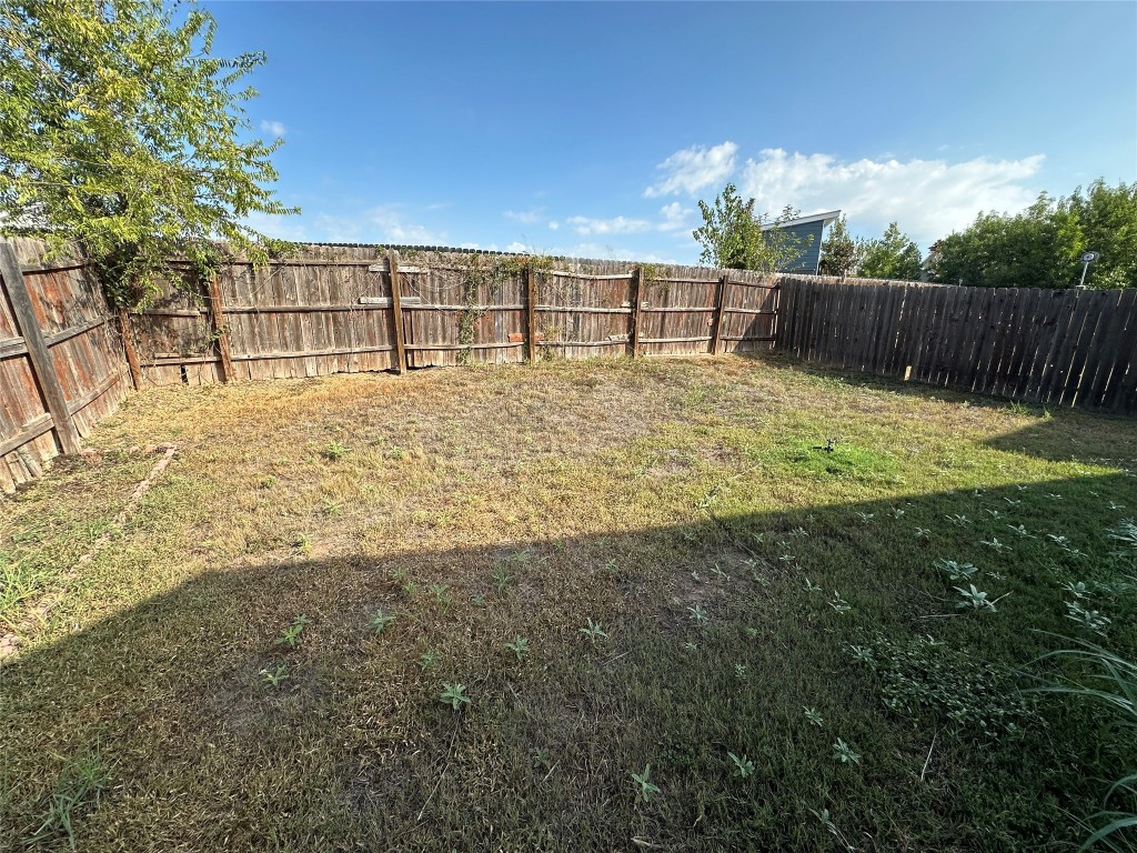 3416 Autumn Bay Drive Austin, TX 78744 - Photo 12 of 14 a view of a backyard with a garden