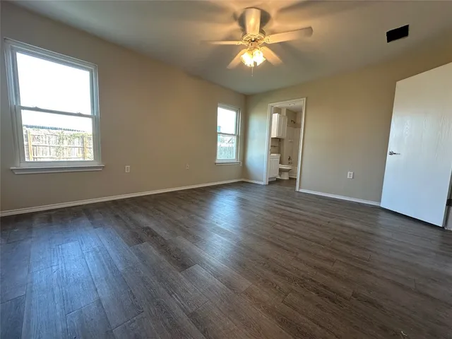 a view of a room with wooden floor