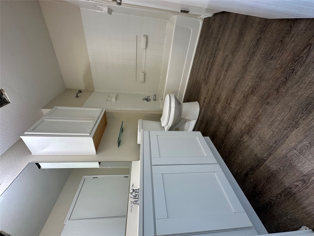 3416 Autumn Bay Drive Austin, TX 78744 - Photo 8 of 14 a bathroom with a sink and a toilet