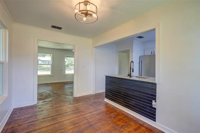 a view of room with wooden floor