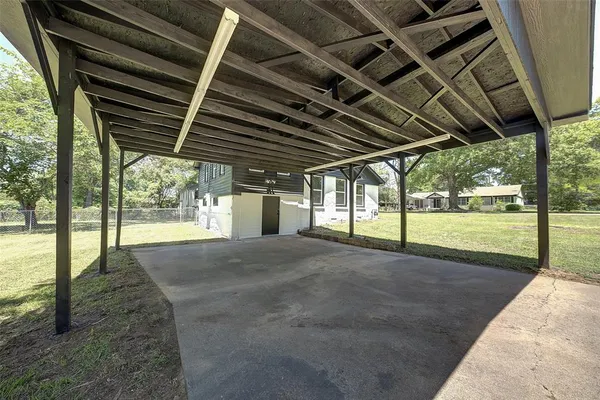 a view of a backyard of the house